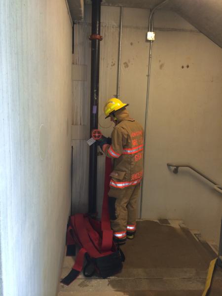 Hooking up to the standpipe riser in the stairwell